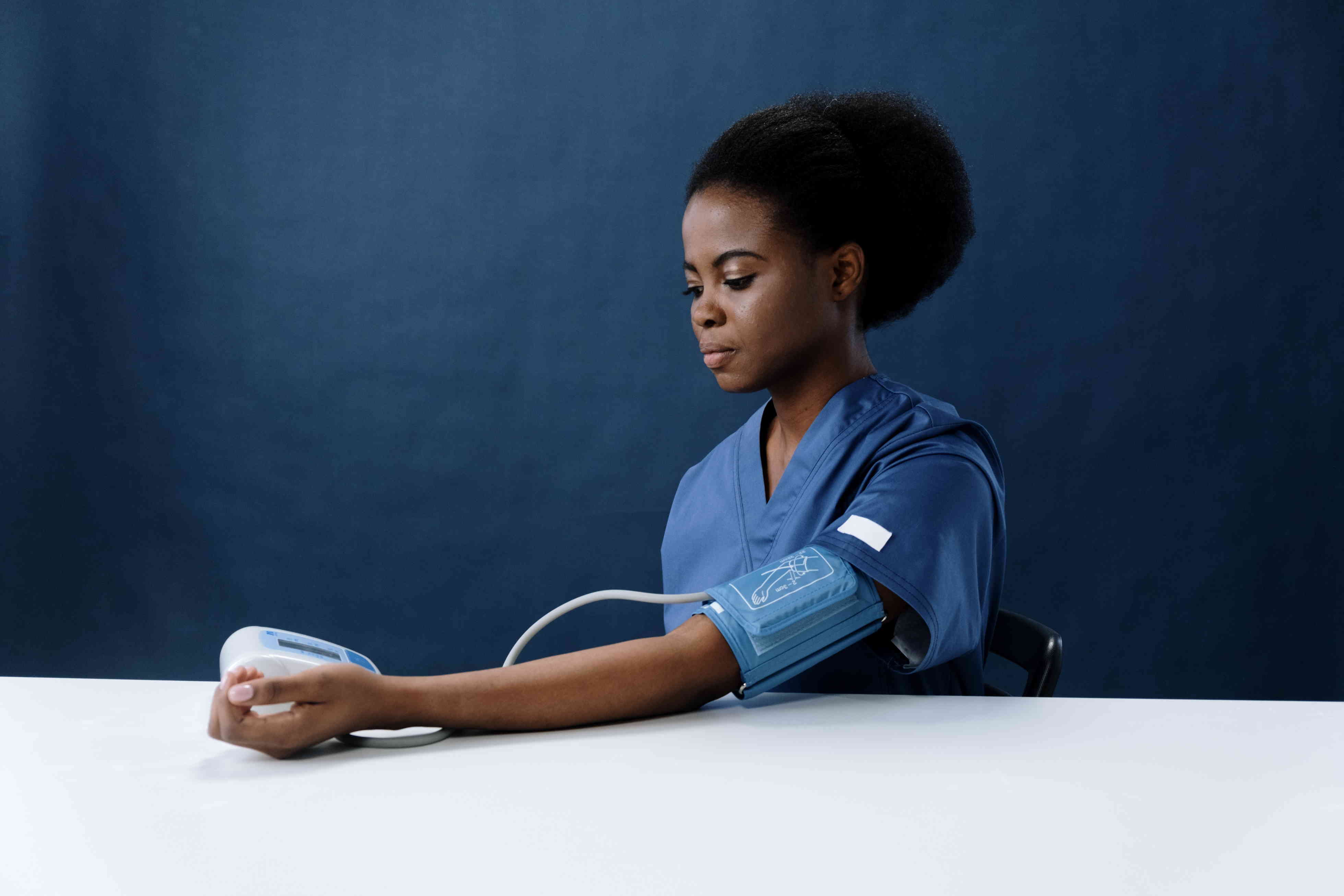 Woman testing her blood pressure